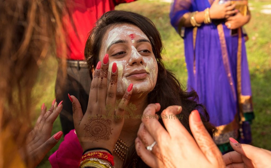 indian bride coloured with yellow tumeric paste in tuscany 1024x636 - Hindu pre-wedding events in a Majestic villa in Tuscany