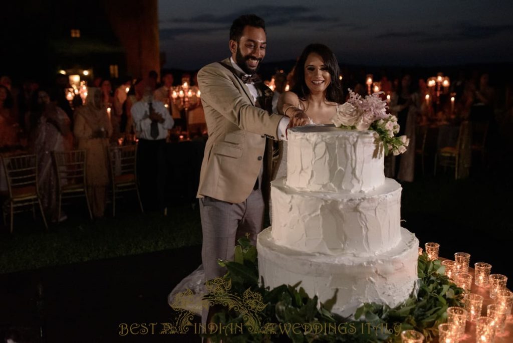 indian couple cutting the wedding cake in a castle in italy 1024x684 - Luxury Indian wedding on the lake in Italy