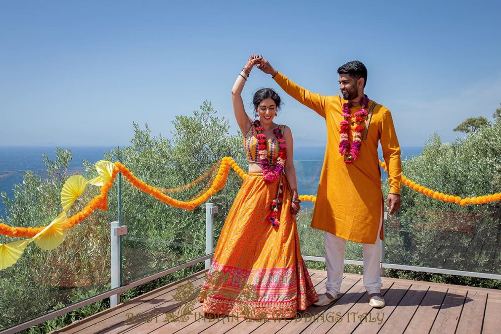 yellow outfits for the indian couple at their pre-wedding events in italy