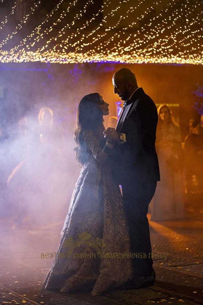 indian couple first dance lights 683x1024 - Elegant Sikh wedding ceremony in the countryside of Italy