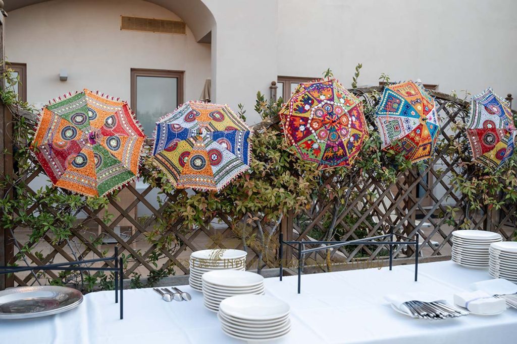 indian umbrellas wedding italy 1024x683 - Sikh pre-wedding event with the backdrop of the crystalline sea