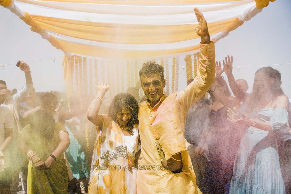 Holi style celebration at Haldi, traditional indian pre-wedding event in Italy